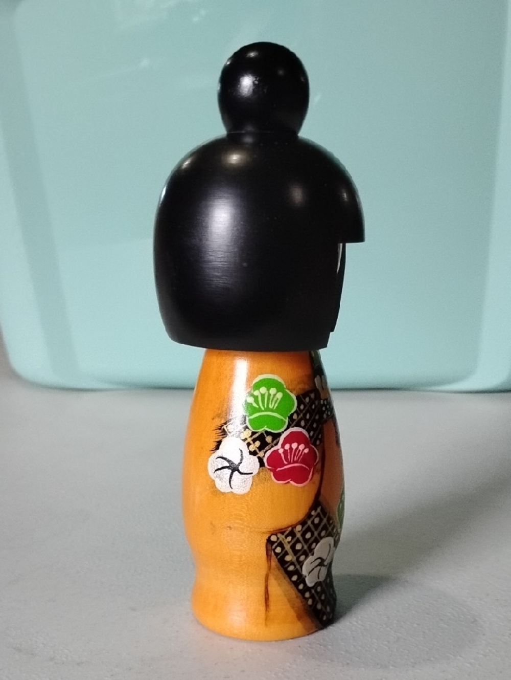 Hand-Painted Wooden Orange Kokeshi Doll with Black Hair - Classic Japanese Style - Picture 4 of 7